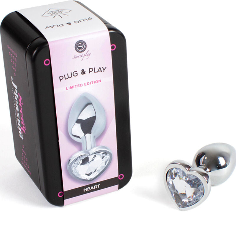 SECRETPLAY Plug Anal de Metal Coração de Cristal Transparente 7cm, mostrando design e material.