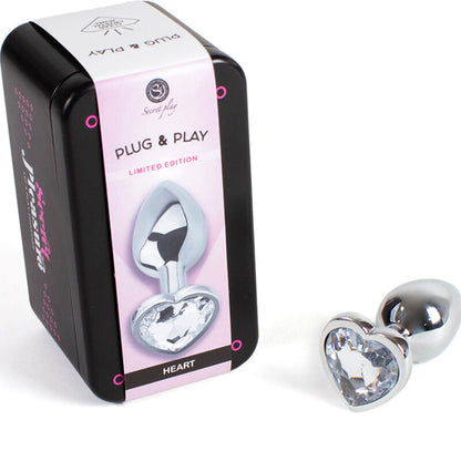 SECRETPLAY Plug Anal de Metal Coração de Cristal Transparente 7cm, mostrando design e material.