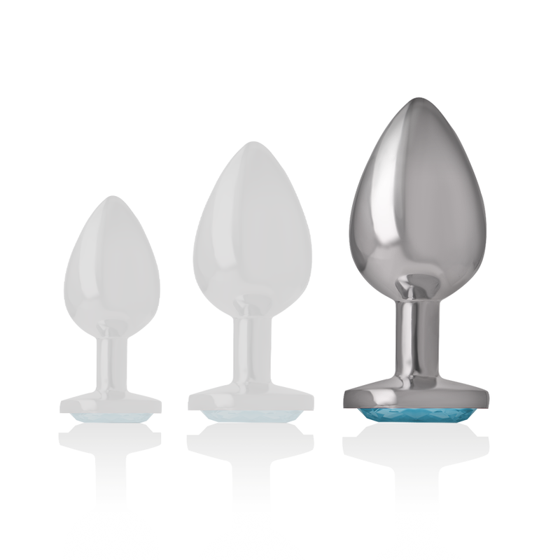 Detalhe do Plug Anal Intense de Alumínio Metal Coração Azul, Tamanho L, mostrando a joia brilhante e a superfície lisa.