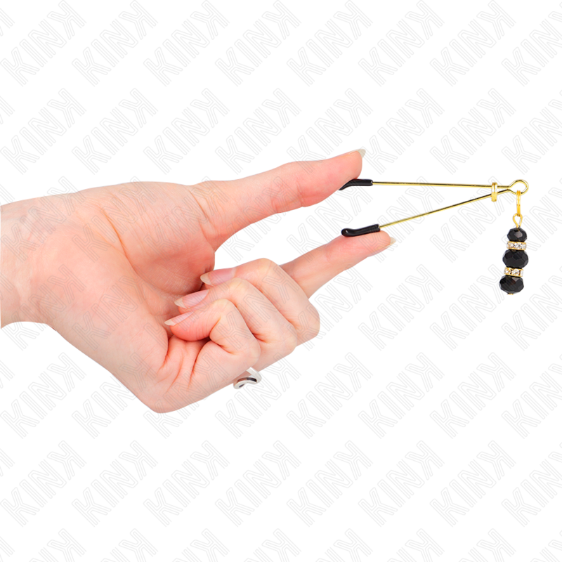 Close-up das Pinças para Mamilos KINK Finas Douradas com 3 Contas Pretas, destacando o design elegante e os detalhes.