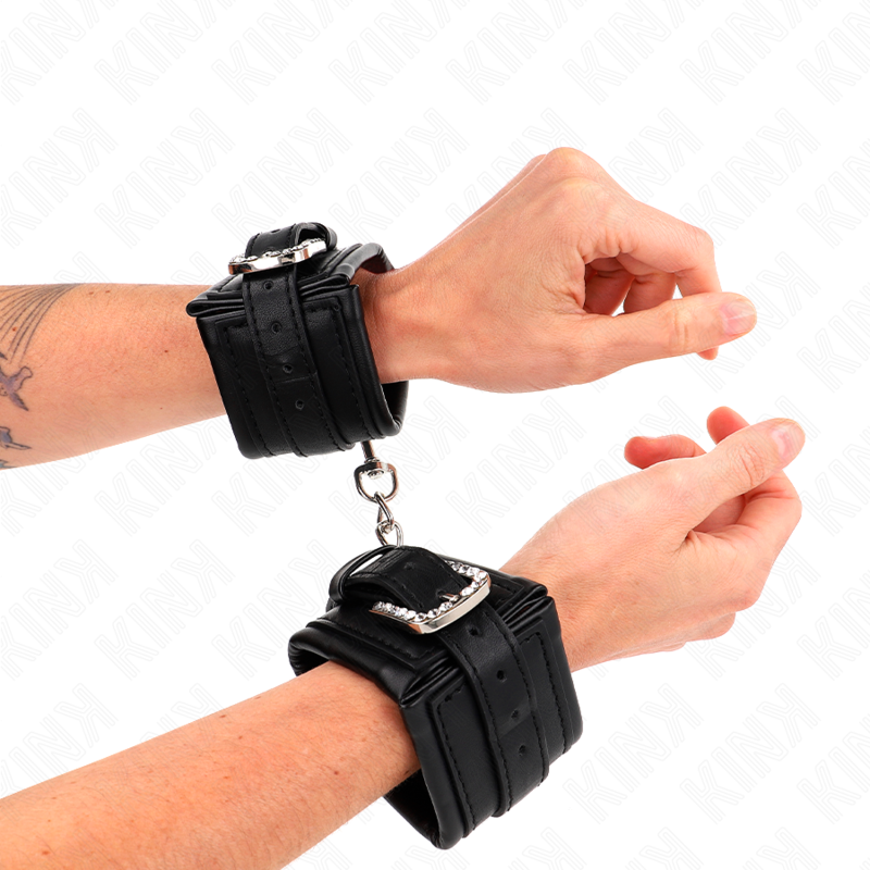 Retenções de pulso KINK com fivela de rhinestone preto, ajustáveis para BDSM.