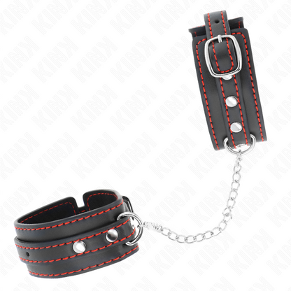 Punhos KINK pretos ajustáveis com forro vermelho para BDSM, exibindo o design e o material de alta qualidade.