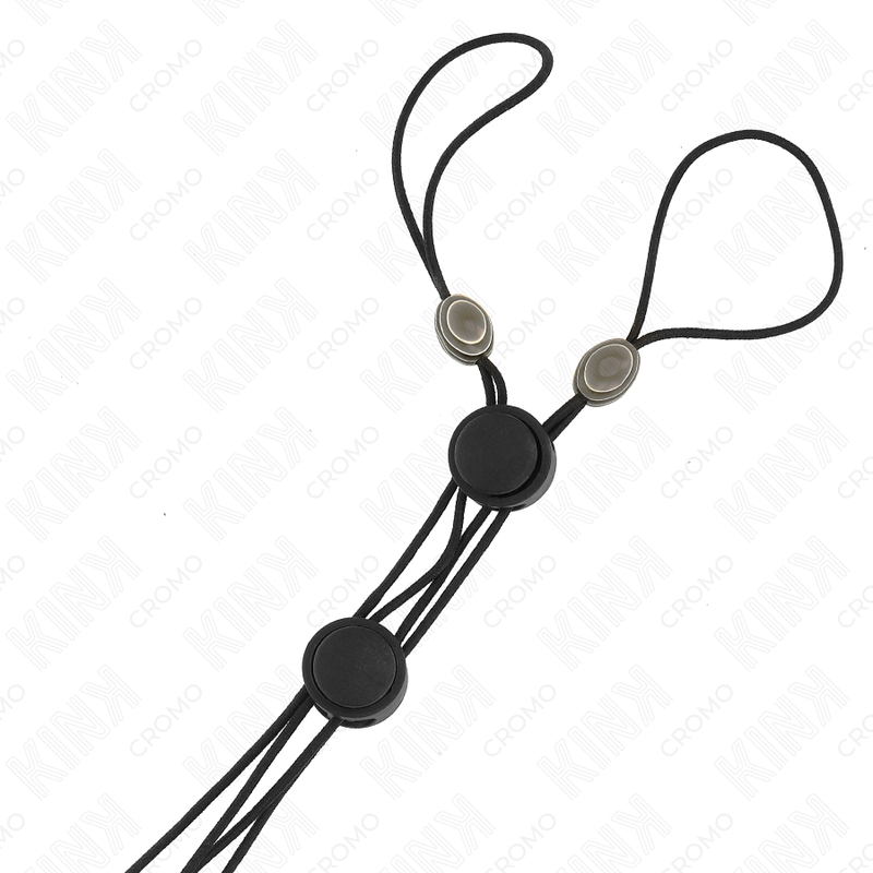 Detalhe dos grampos de mamilos KINK com elástico preto, mostrando o design e ajustabilidade.
