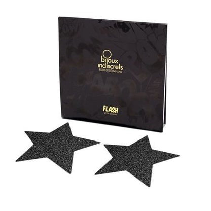 Detalhe dos Bijoux Indiscrets Black Star Flash Nipple Caps autoadesivos com brilho estrela