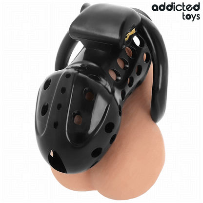 Gaiola de castidade oca ADDICTED TOYS LOCKED com corrente e anéis de tamanhos variados para controlo e submissão.