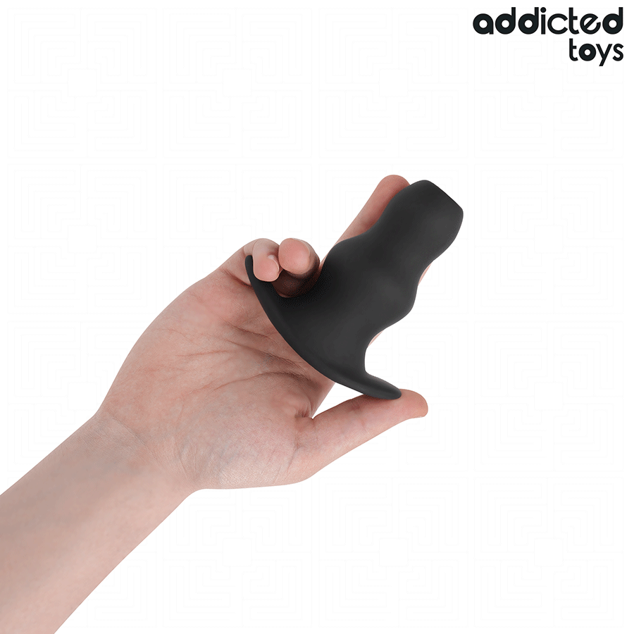 Close-up of the Addicted Toys Hollow Anal Plug M, showing its silicone texture and design for anal exploration.
