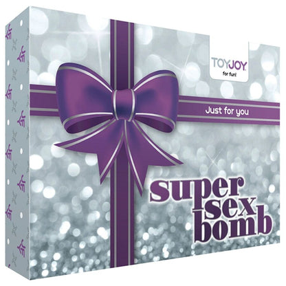 Kit ToyJoy Super Sex Bomb Box com vários acessórios de prazer, incluindo vibrador, algemas e máscara.