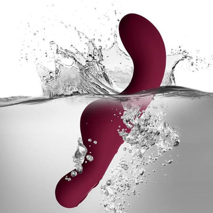 Close-up of the ROCKS-OFF Vibrador Ruby Glow Blush Vermelho 2 em 1 with remote control, highlighting its ergonomic design and dual functionality.