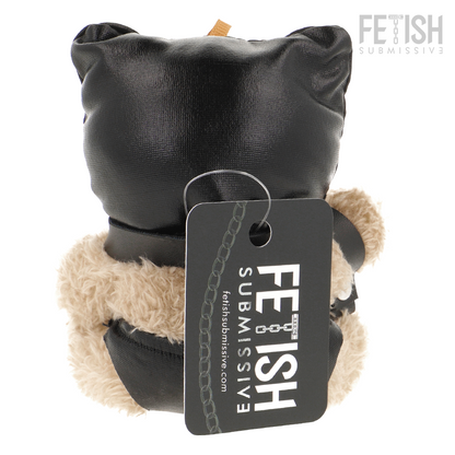 Urso de Pelúcia BDSM Luno da FETISH SUBMISSIVE com máscara preta e chicote, detalhes de arreios e correntes.