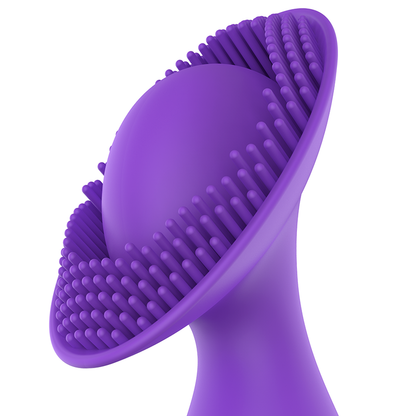 Close-up do vibrador clitoriano Womanvibe Puppy mostrando seu design ergonómico e almofada de estimulação.